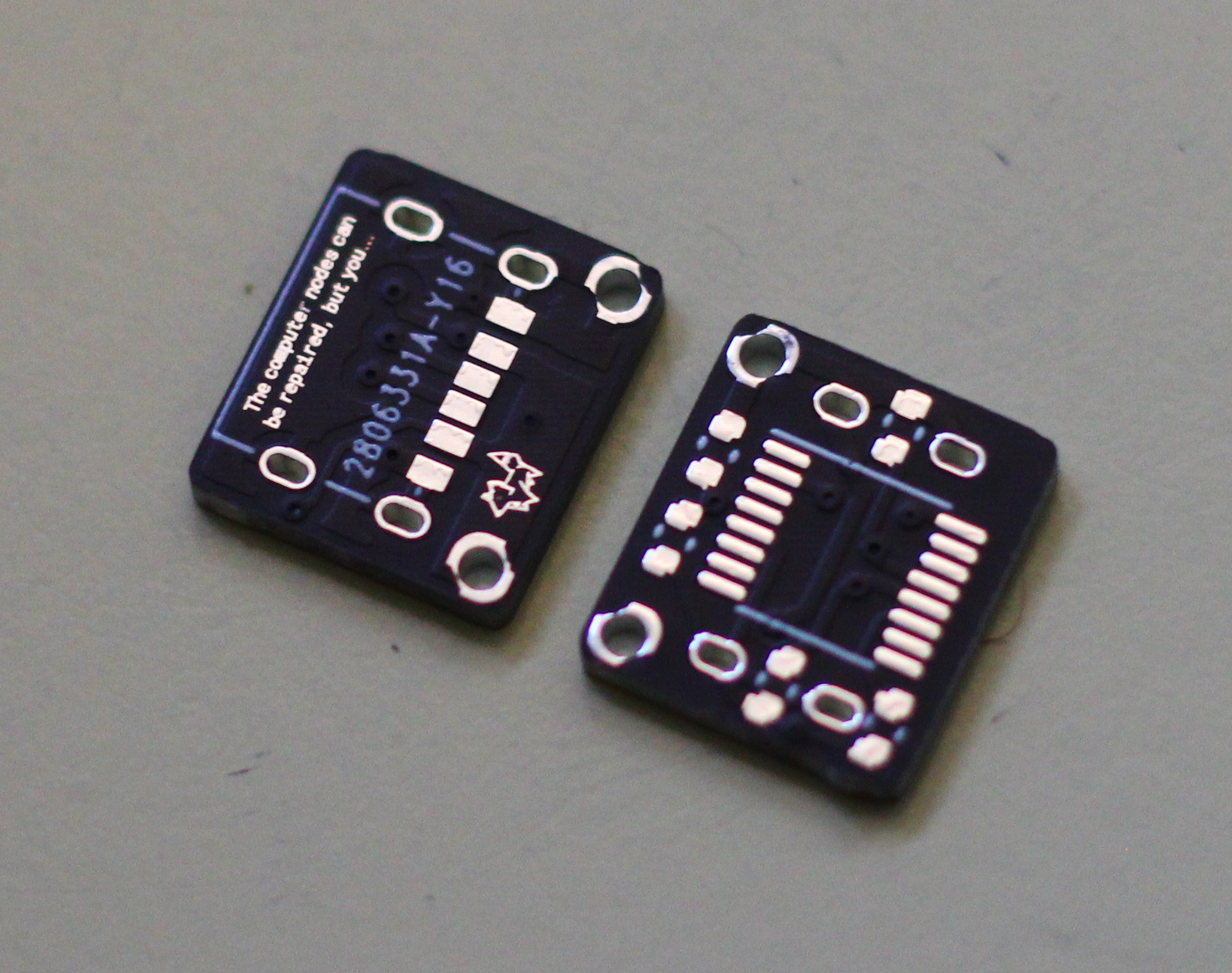 Two tiny rectangular PCB's, one side 